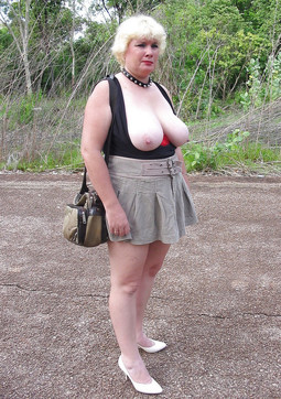 Chubby mature posing naked in the woods